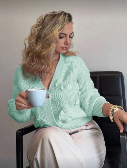 Cardigan rose à noeuds